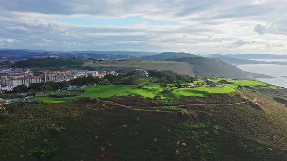 Monte de San Pedro Municipal Park and its atlantic viewpoint dome on a cape. Aerial alt
