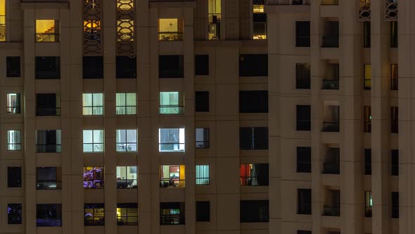 Evening View of Exterior Apartment Recidential Building Timelapse with Glowing Windows alt