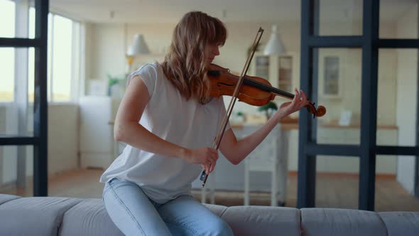 Teenage Girl Playing Violin. Violinist Playing Chords on Musical