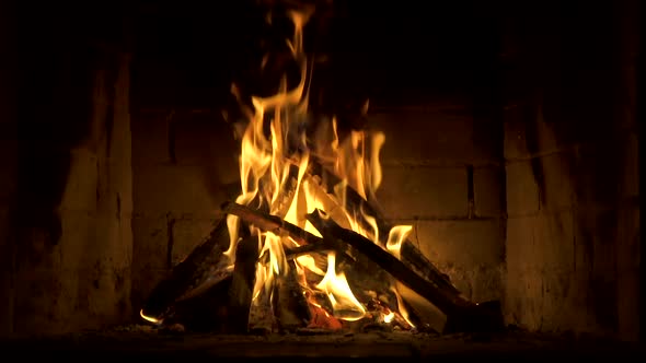 Burning Fire In The Fireplace Slow Motion A Looping Clip of a Fireplace with Medium Size  alt