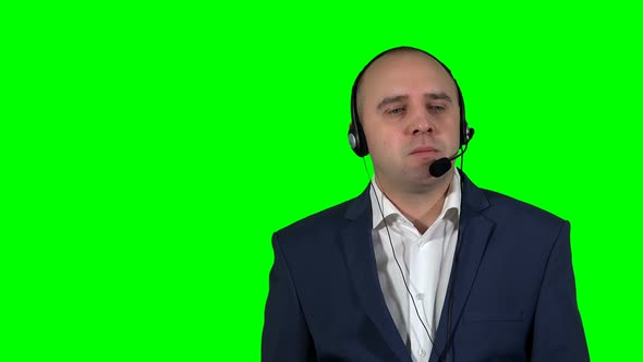 Emotional Man in Call Center Isolated on Green Background