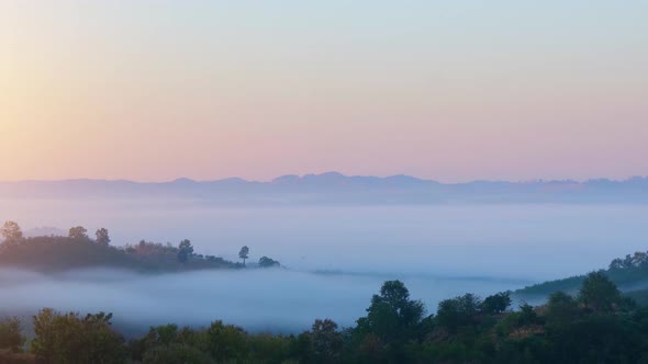 4K : Colorful sunrise over mountains tops in thailand alt