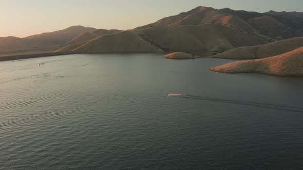 Aerial Drone Tracking Shot of a Jet Ski on.a Mountain Lake During Sunset (Lake Kaweah, Visalia, CA)