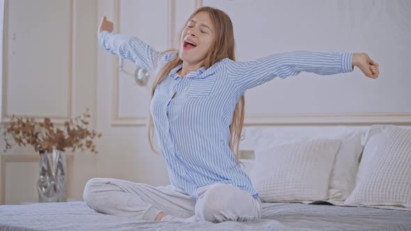 Young Female Wake Up Posing in Bedroom