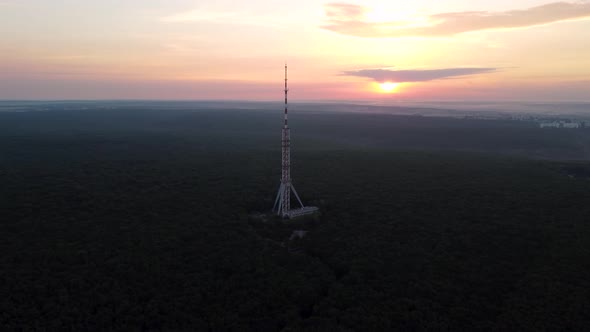 Aerial sunrise epic view forest with telecom tower