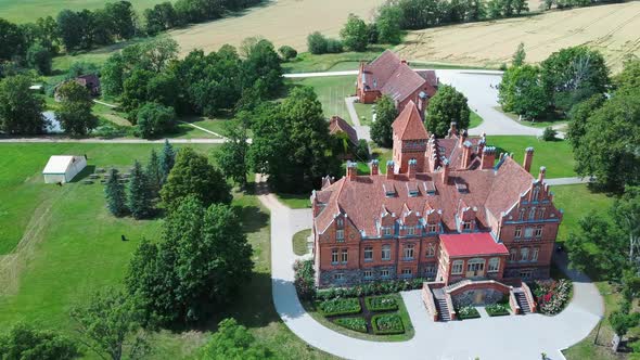 Jaunmoku Brick Medieval Castle Near Tukums, Latvia  Aerial Dron 4k Shot Jaunmokas Manor Park alt
