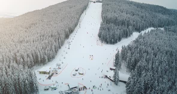 Tourists Travelers Ski on White Snow Mountain Hill on Winter Vacation in Bukovel in Ukraine alt