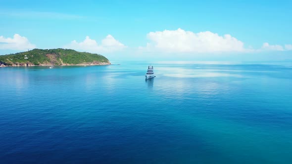 Aerial drone shot tourism of relaxing sea view beach holiday by aqua blue ocean with white sandy bac alt