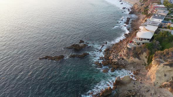 Flying over million dollar beach front homes and the beautiful Laguna Beach California tide pools at alt