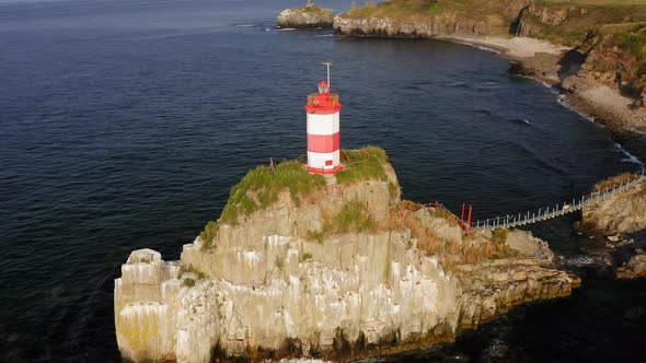 Drone View of the Picturesque Old Basargin Lighthouse on the Coast of the Sea alt