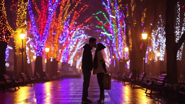 Couple with kissing at night alley in Odesa, Ukraine