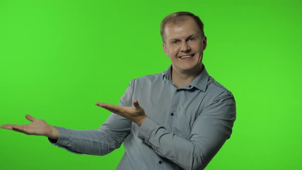 Come Into My Arms, Join Me. Man Smiling Kind and Stretching Hands To Camera, Going To Embrace, Hug alt