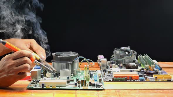 Smoke From A Soldering Iron On Computer Mainboard alt