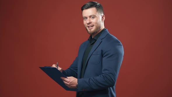 Young elegant businessman standing on background alt