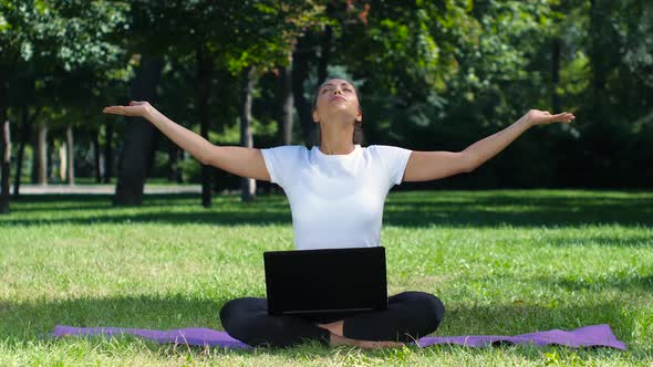 Woman Working with Laptop Sitting Lotus Pose alt
