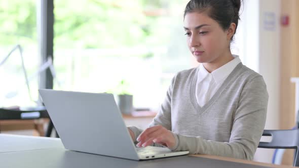 Disapproving Indian Woman with Laptop Showing No Sign alt