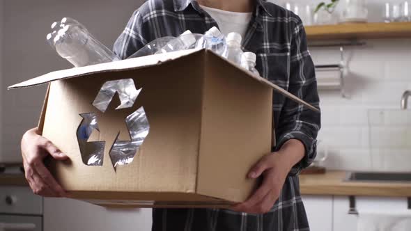Active Young Girl Carries A Box With Sorted Items From Plastic Bottles For Recycling Recycling alt
