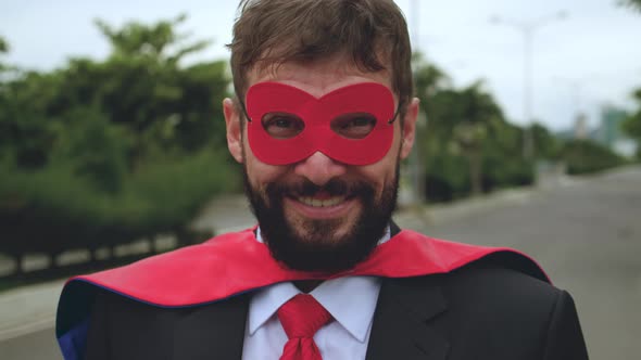 Portrait of a Positive Smiling Bearded Professional Businessman of Senior Man in a Red Raincoat and alt