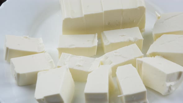 Slices feta cheese close up alt