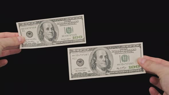 Two Banknotes of 100 Dollars in Male Hands with Alpha Channel alt