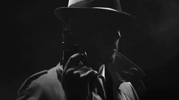 Retro detective spy holding a revolver