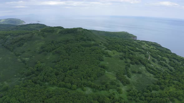 Mayachny Cape on Kamchatka Peninsula on Picturesque Avacha Bay Coast Covered By Green Grass in the