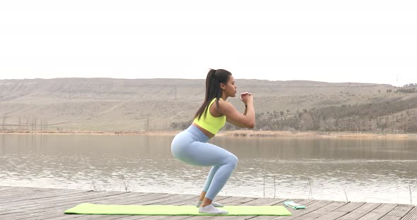 Fitness black woman doing lunges exercises for leg and buttocks muscle.