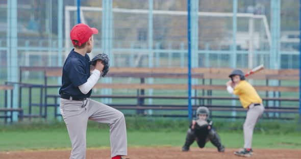 Slow Motion Baseball Tournament at School Boys Play Baseball the Pitcher Throws the Ball Toward a alt