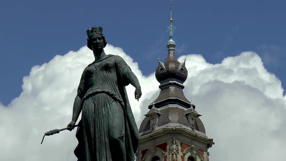 Close up view of the Column of the Goddess and Chamber of Commerce Belfry in Lille, France.