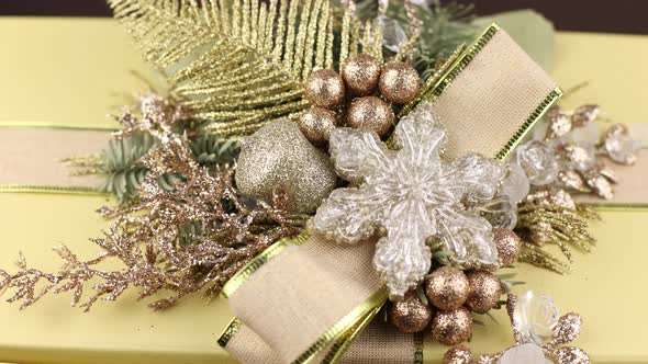 New Year's decor on a box with a gift. Background of the holiday of the new year of Christmas with c alt