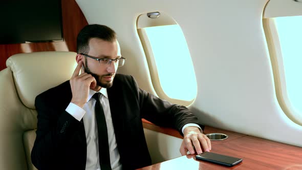 Arabian man flying on his Private jet to dubai. alt