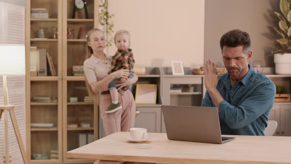 Working Man Distracted by Family alt