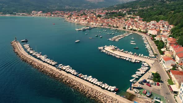 Aerial view above of Baska boat pier during the summer, Croatia. alt