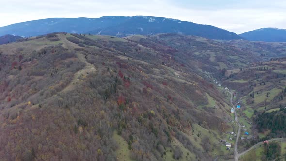 Small Village Along a Road in a Mountain Gorge Carpathian Mountains in Ukraine alt