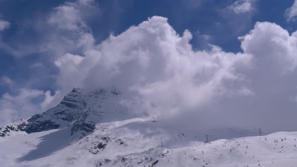 Landscape View of Alpine Mountain Snowy Peak in the Clouds, Simplon Pass alt