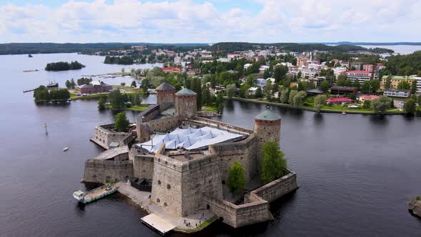 Rotating Aerial Drone Shot of Medieval Castle Olavinlinna (Finland) on a Summer Day, Savonlinna City alt