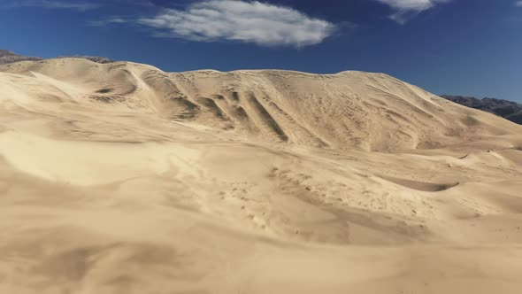 Aerial Establishing Drone Flying Fast Above Sand Dune with Desert Wilderness alt