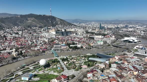 Aerial view of center of Tbilisi under Mtatsminda mountain, Georgia 2022 spring alt