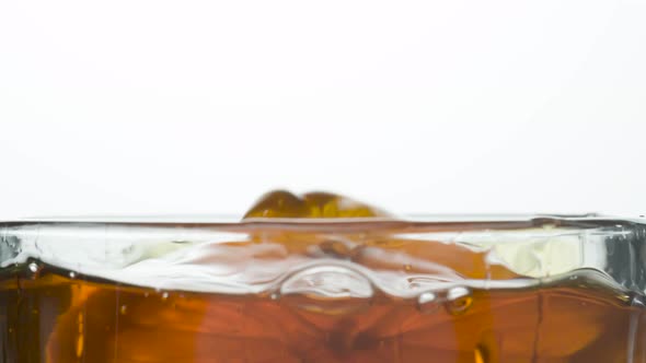 Falling Lemon Slices Into A Tea Cup