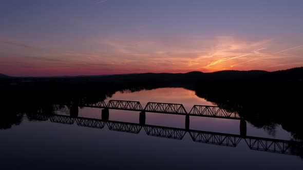 Stunning Sunset Aerial Of Bridge Over River