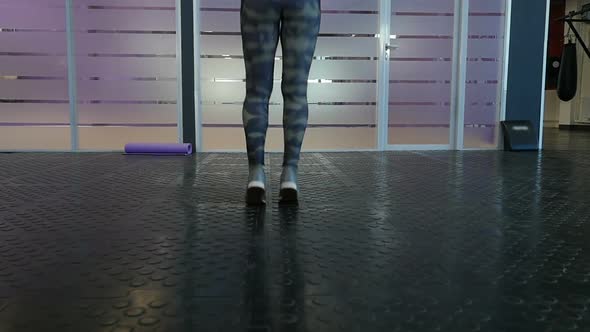 Legs of Energetic Fitness Girl Jumping a Skipping Rope in Fitness Wellness Studio Gym. alt