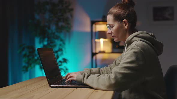 Woman Coding Late on Laptop