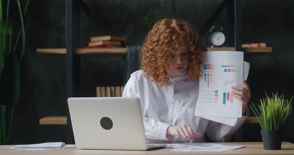 Redhaired Woman with Curly Hair Using Laptop for Remote Video Calling Takes a Part in Virtual alt