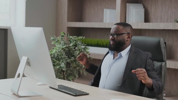 African American in Business Suit Office Worker Gets Uncomfortable in His Office Chair and Sour Back alt