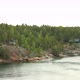 Many Swedish Wooden Sauna Logs Cabins Houses On Island Coast In Summer Cloudy Day - VideoHive Item for Sale