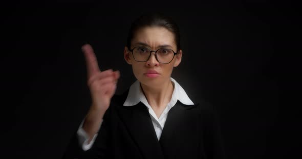 Business Woman with Glasses Threatened the Camera with Finger