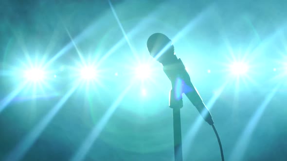 Closeup of Microphone on Stage Against the Background of Concert Lighting alt
