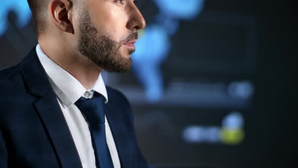 Closeup Bearded Business Man in Suit Tie Brainstorming at Infographic Scheme Global Map Screen alt