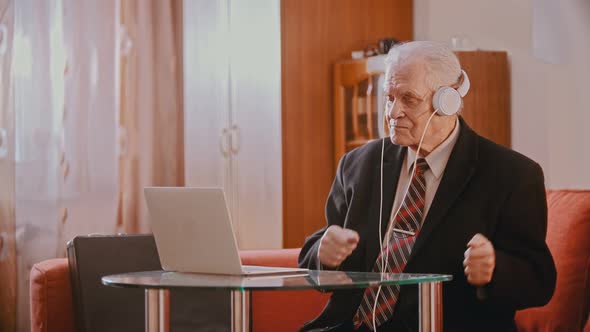 Elderly Grandfather - Aged Grandfather in Headphones Dancing To the Music alt
