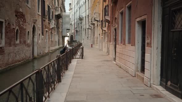 Real Time Shot of a Street with a Canal in Venice. Venice Is a Major Tourist City.